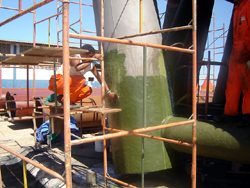 SplashZone Being Spread on Round Piling 250