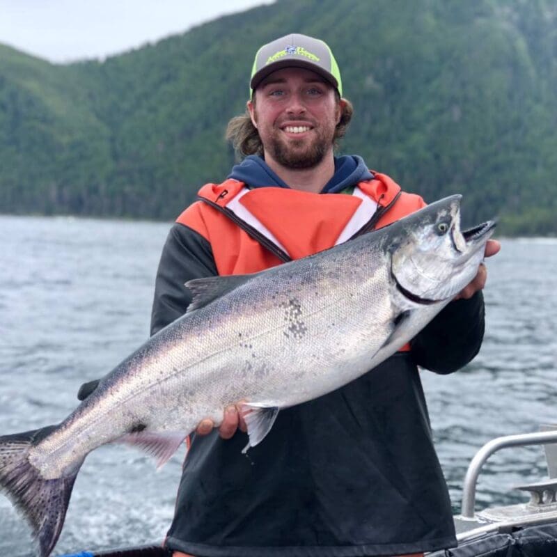 AU Captain Tyler Floding holds an Alaskan salmon
