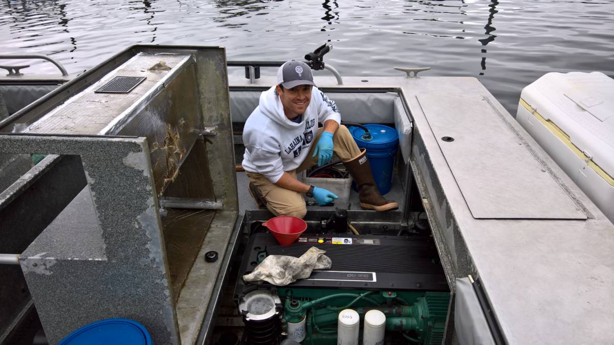 Man repairs a boat