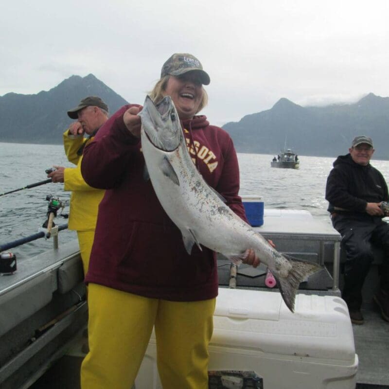 Angling Unlimited guest holds a salmon