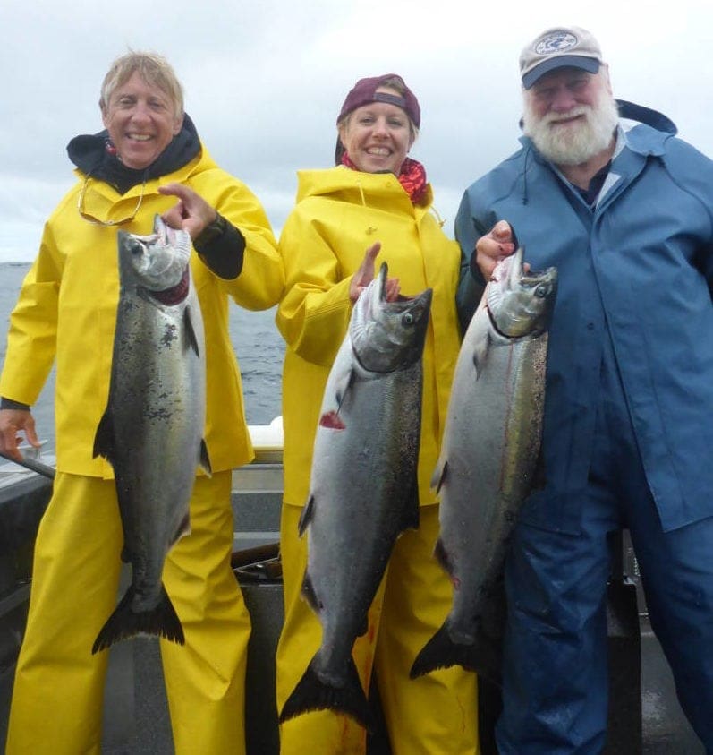 Angling Unlimited guests hold salmon