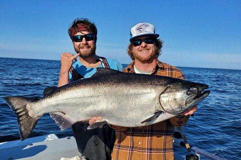 Captain James and Deckhand Sam with big king in Sitka, AK with Angling Unlimited