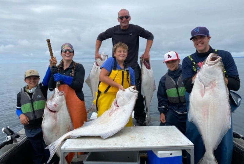 The Glassburn gang and Captain Sarah with a great halibut catch for Angling Unlimited in Sitka, AK