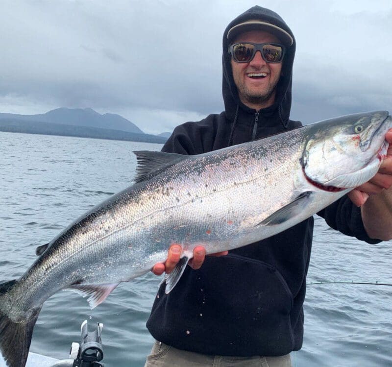 Captain Jaime at Angling Unlimited holding a salmon