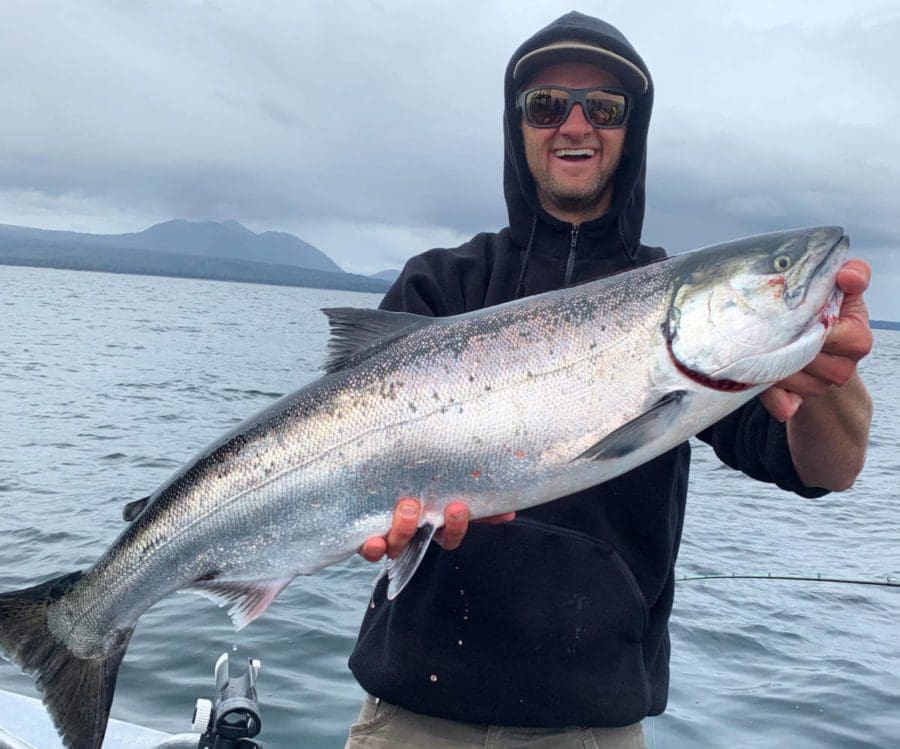 Captain Jaime at Angling Unlimited holding a salmon