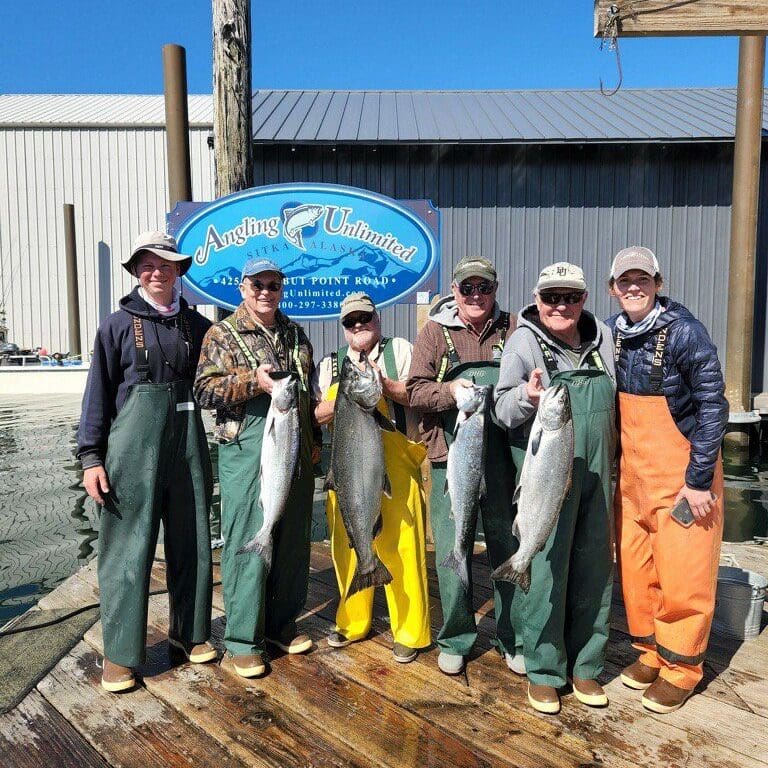 Angling Unlimited guests pose with Captain Sarah Farber
