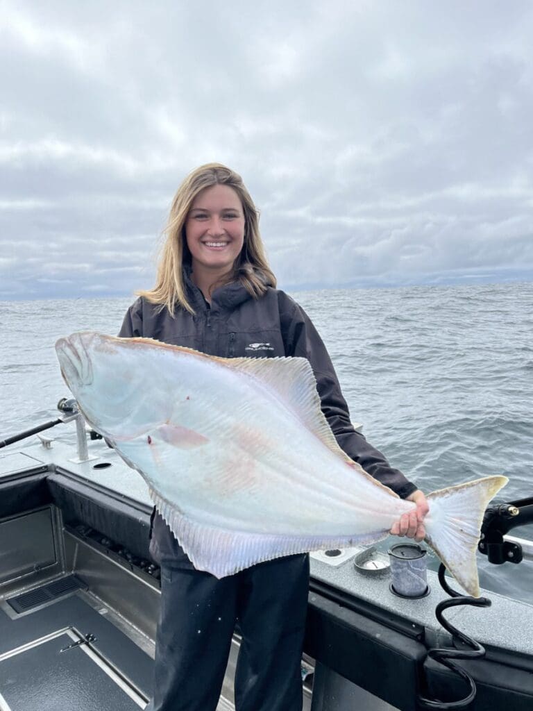 Angling Unlimited guest holds an Alaskan halibut