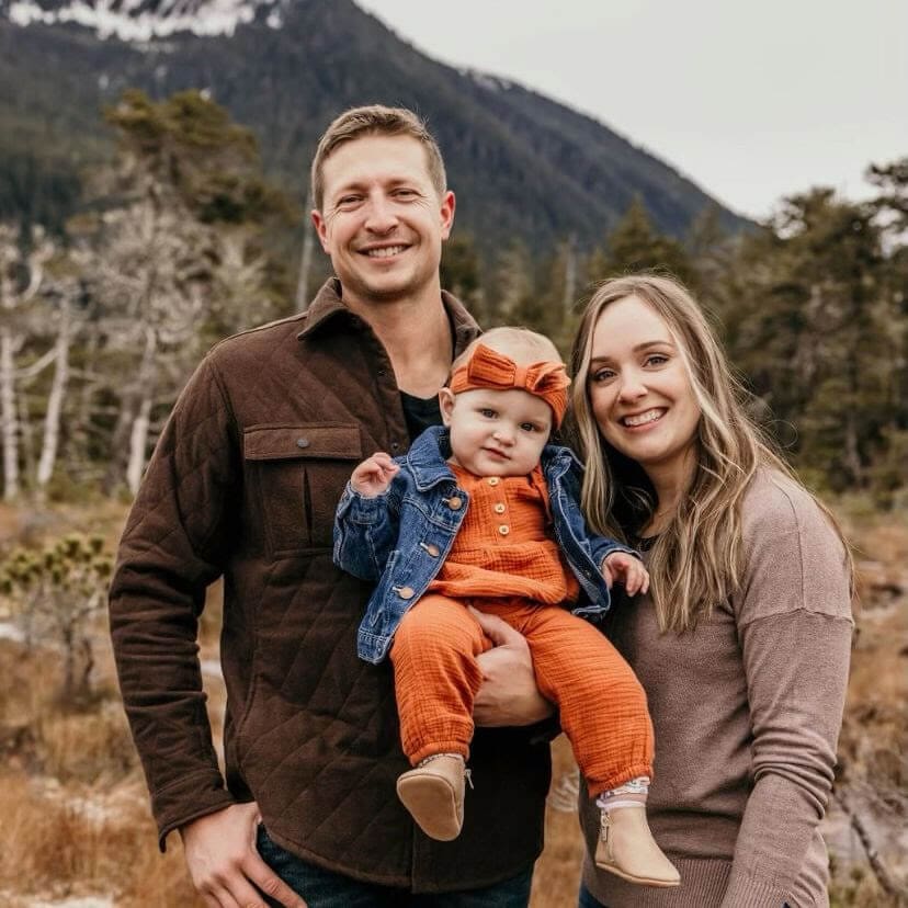 Couple holds their baby