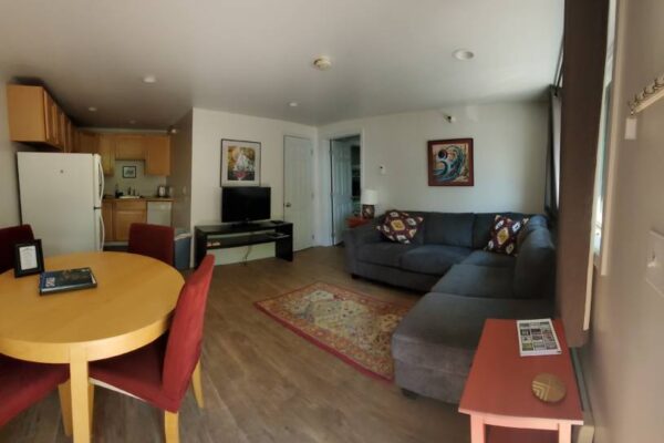 Living room and kitchen of a waterview suite in Sitka, Alaska
