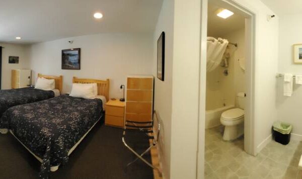 Bedroom and bathroom of a waterview suite in Sitka, Alaska
