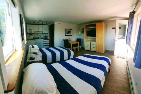 Bedroom and kitchen at a waterview suite in Sitka, Alaska