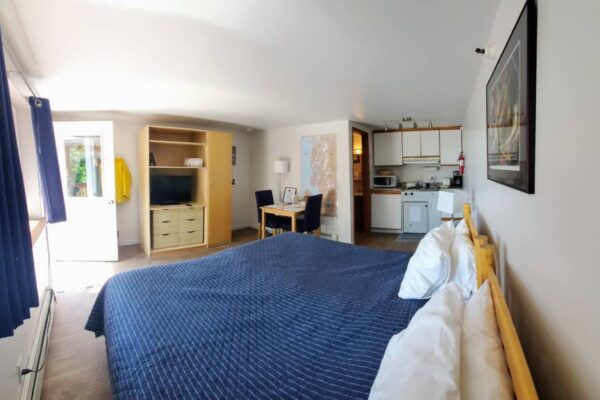 Bedroom and kitchen at a waterview suite in Sitka, Alaska