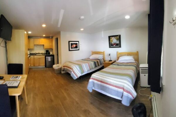 Kitchen and bedroom of a waterview suite in Sitka, Alaska