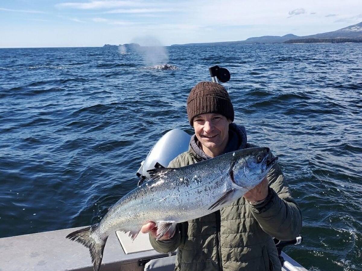 Young Angling Unlimited guest holds a salmon