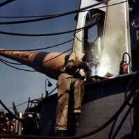 A welder constructs the face of one of IOWA