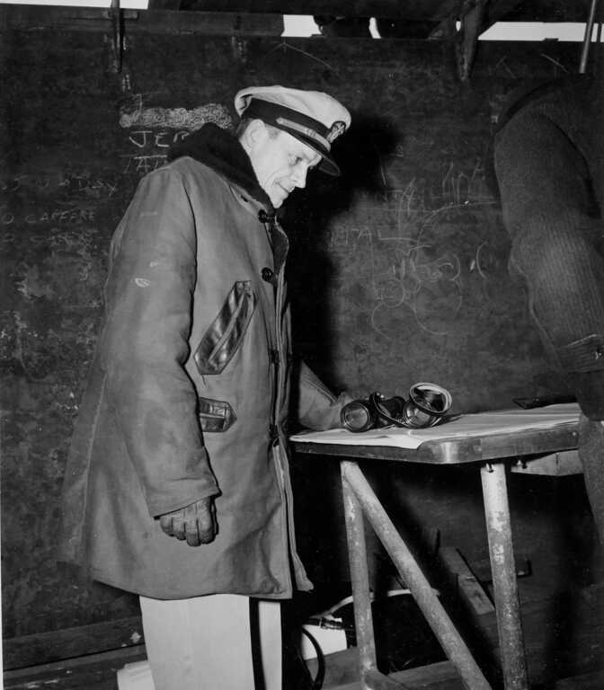 Iowa Construction Engineer LCDM George J Blessing reviewing IOWA's construction plans. Fall 1942 - 80-G-13587 picture number 1