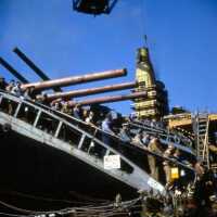 Shipyard workers departing IOWA from the forward gangway. Turrets 1 & 2