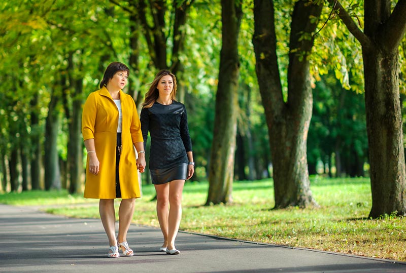 elderly-woman-walking-daughter-shutterstock