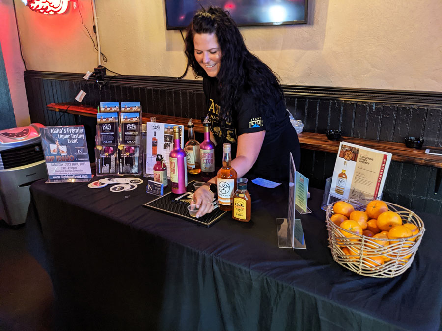 Jennifer Rogers sets the Grand Teton Distillery display