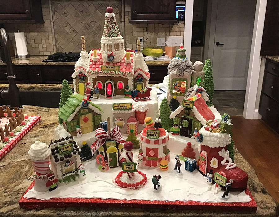 A gingerbread house representing Santa%E2%80%99s workshop made by Geri Hansen