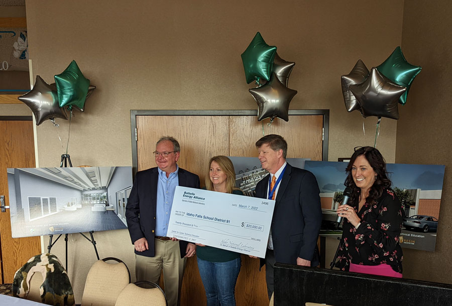 Idaho Falls School District 91 receive a check for $20,000 from INL reps.