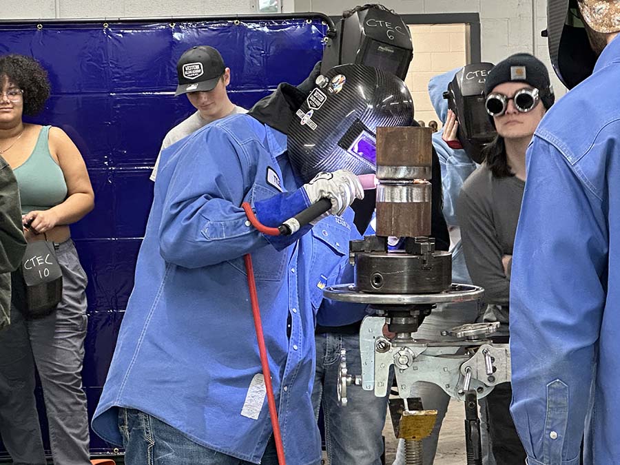 Tour bus with welders from Wyoming stops in Idaho Falls to visit