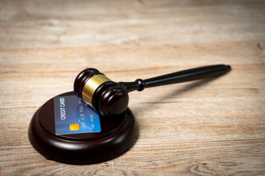 court gavel with credit card