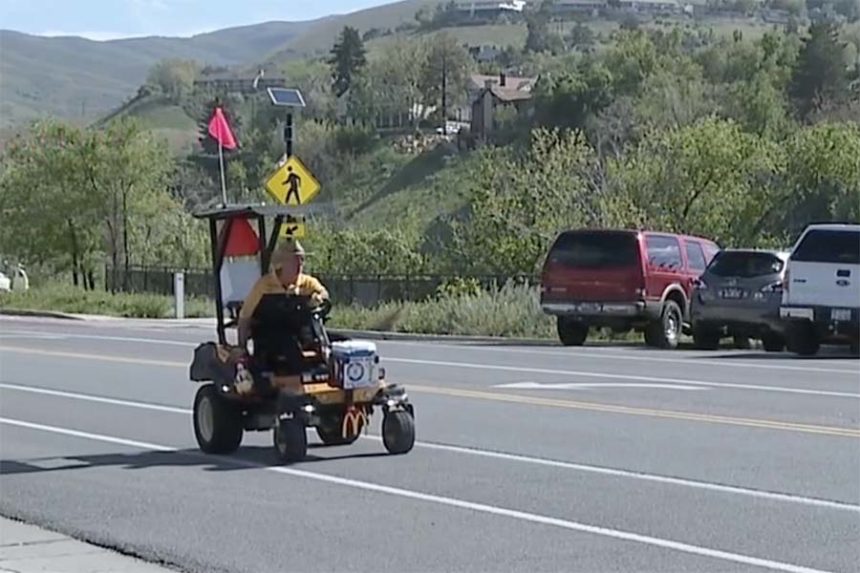 Scott Morgan rides lawn mower