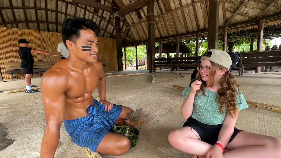 Emmy learns how to hula dance, start a fire with sticks and asks 7 Questions at the Polynesian Cultural Center in Hawaii
