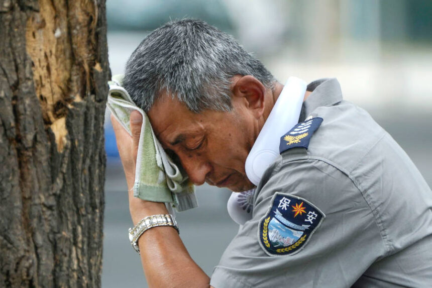 chinese security guard on hot day