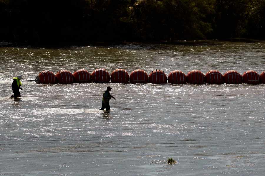 Justice Department sues to force Texas to remove floating barriers in Rio Grande