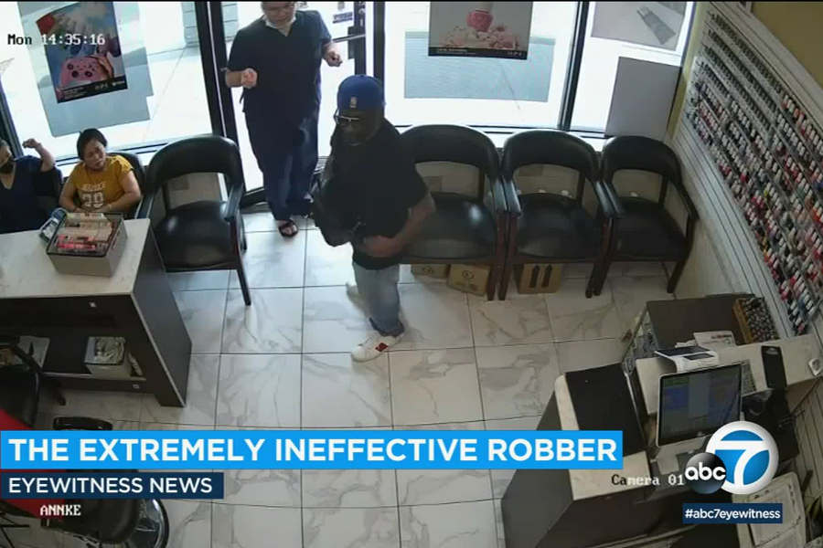 WATCH: Customers at Atlanta nail salon ignore man trying to rob them