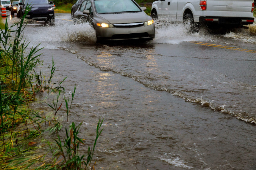 Cars driving through water