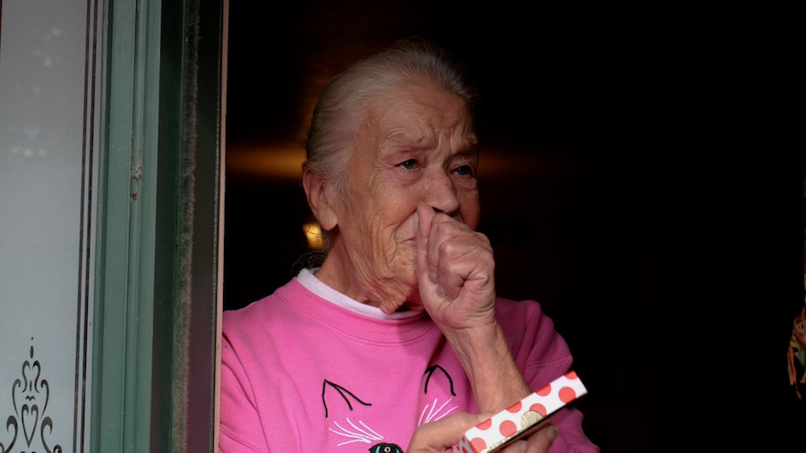 A Secret Santa surprises a stunned grandmother who walks everywhere and is raising two grandchildren