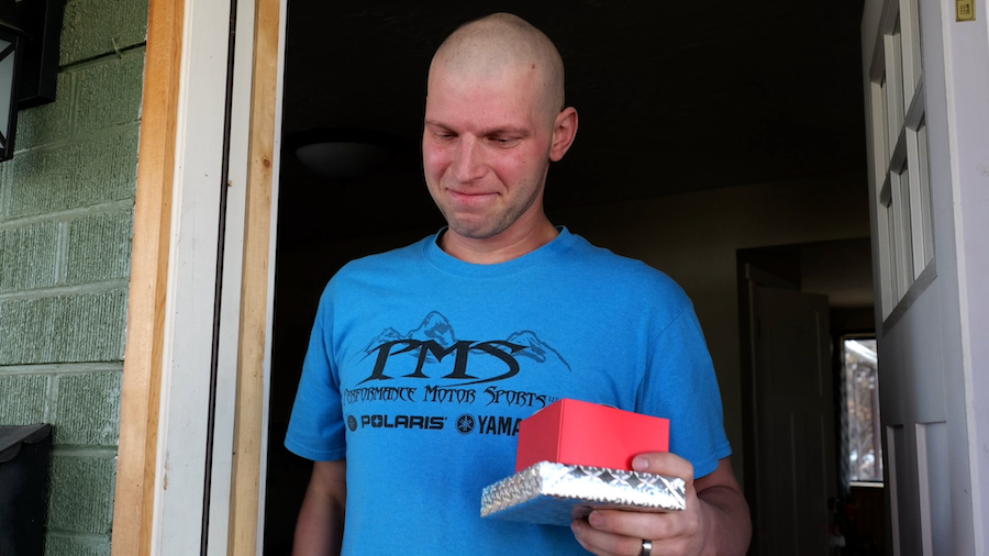Young father battling cancer gets a Secret Santa surprise while recovering at home