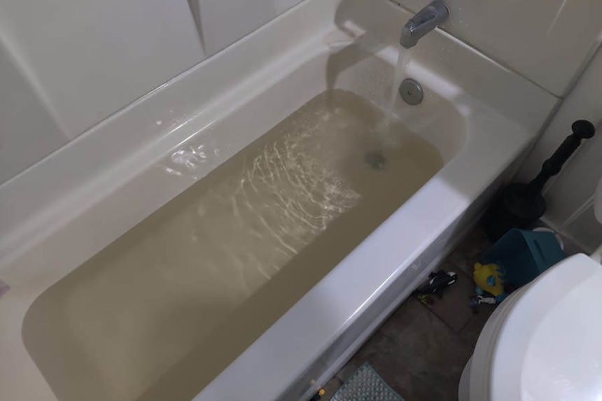 Yellow water in a bathtub