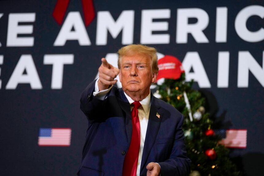 Former President Donald Trump points to supporters during rally Dec. 19, 2023, in Waterloo, Iowa. (AP Photo/Charlie Neibergall, File)