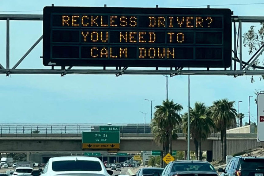 electronic sign says 'calm down' before taylor swift concert