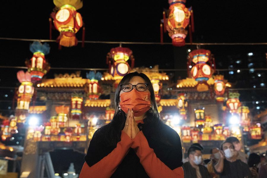 A woman offers prayer for Lunar New Year.