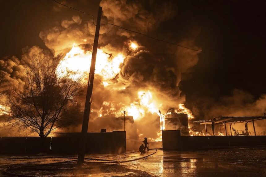 Firefighters extinguish a fire after a Russian attack