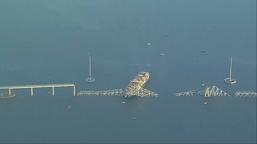 Cargo ship hits Baltimore’s Key Bridge, bringing it down. Rescuers are looking for people in water.