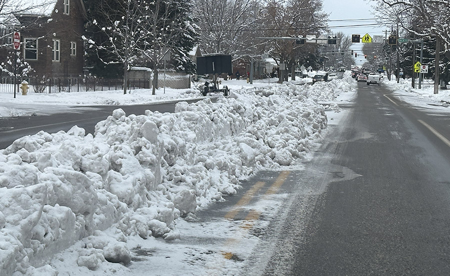Why does Idaho Falls plow snow into the middle of the road?