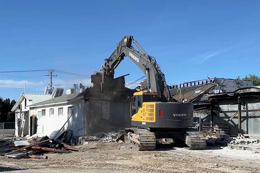 Reed’s Dairy building destroyed in fire earlier this year is being demolished