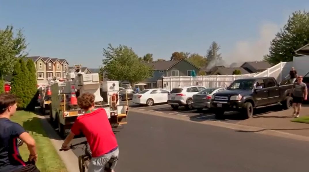 Small plane carrying at least 2 people crashes into townhomes near Portland, engulfs home in flames