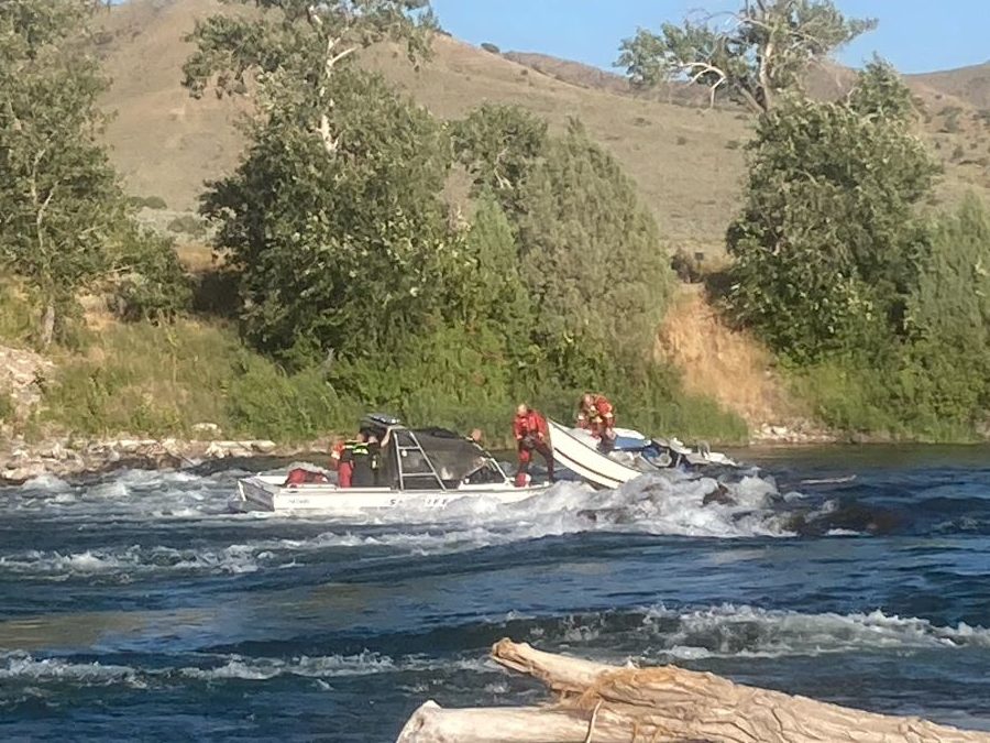 Three adults and two dogs rescued from swift moving Snake River