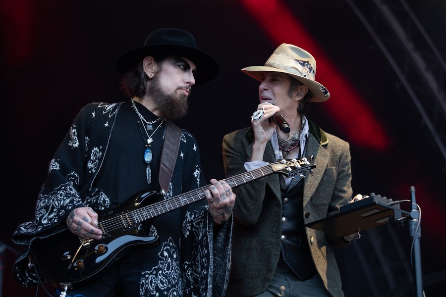 Rock band issues apology, cancels show after on-stage scuffle