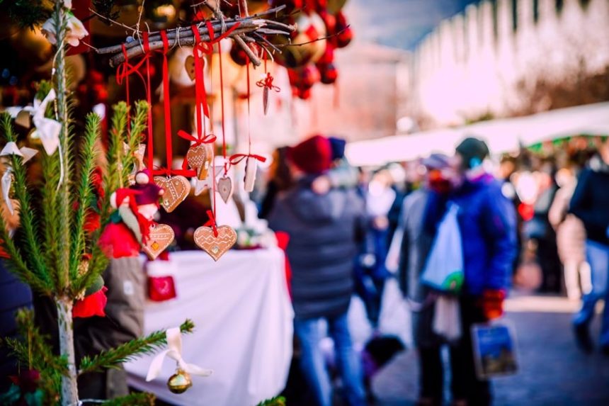 People walking around at a Christmas-themed outdoor market