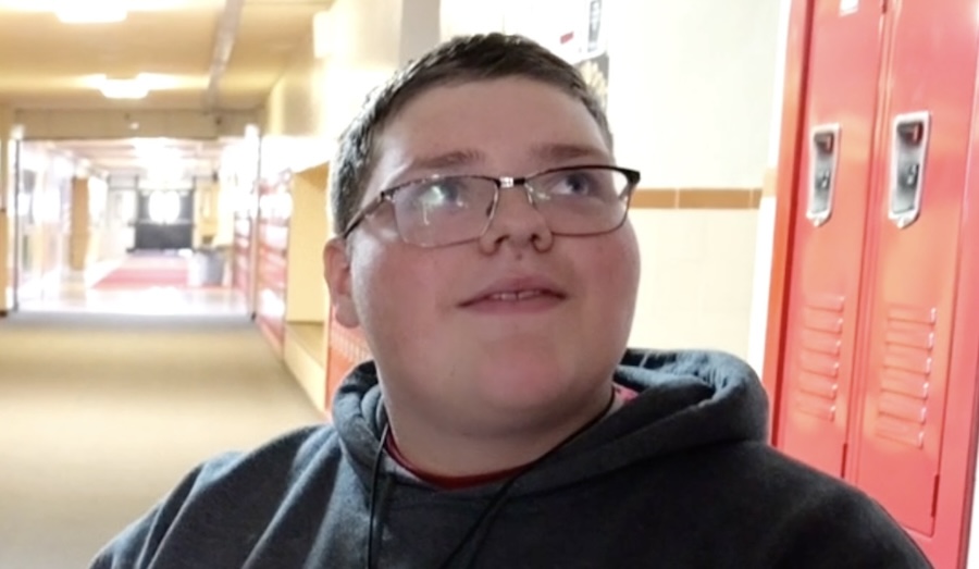 Young man born without feet has no clue what’s happening when we show up at school with a Secret Santa gift