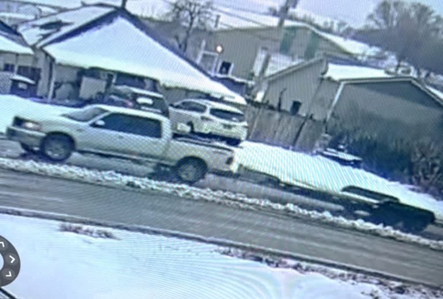White pick-up truck pulling a trailer