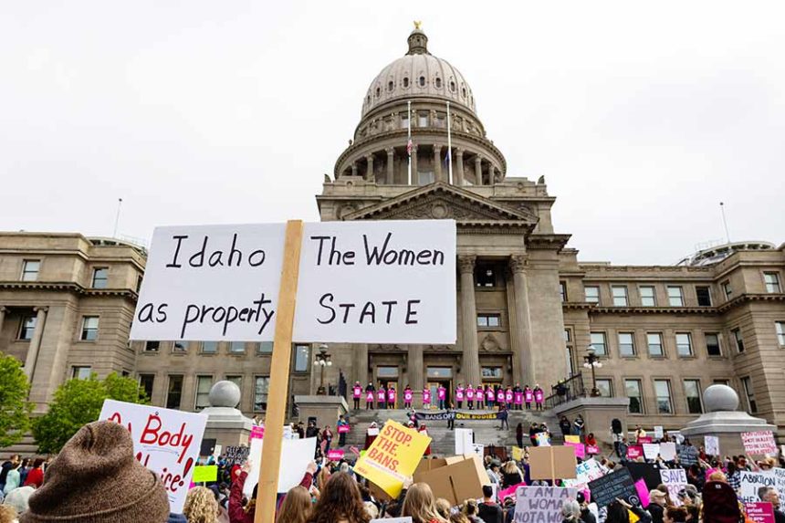 FILE - An attendee at Planned Parenthood's Bans Off Our Bodies rally for abortion rights holds a sign reading outside of the Idaho Statehouse in downtown Boise, Idaho, on May 14, 2022. (Sarah A. Miller/Idaho Statesman via AP, File)